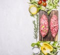 Crude kebab on a skewer with vegetables on a cutting board border ,place text wooden rustic background top view close up Royalty Free Stock Photo