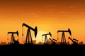 Crude oil Pumpjack on oilfield on sunset. Royalty Free Stock Photo