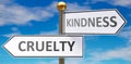 Cruelty and kindness as different choices in life - pictured as words Cruelty, kindness on road signs pointing at opposite ways to