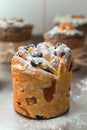 Cruffin as Easter cake decorated with raisins, dried apricots and sugar powder on kitchen table Royalty Free Stock Photo