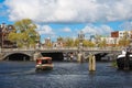 Cruise boat at Amsterdam canals in Amsterdam Royalty Free Stock Photo