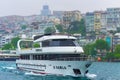 Cruise boat on Bosphorus strait on rainy spring day Istanbul city Turkey Royalty Free Stock Photo