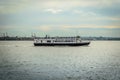 A Cruise Boat full of Tourists  on its Way to Statue of Liberty Island in New York City Royalty Free Stock Photo