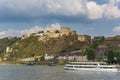 Cruise boat passing the historic Ehrenbreitstein fortress in Koblenz