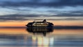 cruise  ship  in port at night cloudy dramatic sky water reflection blue sea and sky  color In harbor Tallinn Estonia Baltic se Royalty Free Stock Photo
