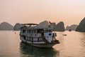 Cruise boat at sunset Halong bay Royalty Free Stock Photo