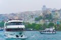 Cruise boats on Bosphorus strait on rainy spring day Istanbul city Turkey