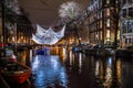 Cruise boats rush in night canals. Light installations on night canals of Amsterdam within Light Festival. Royalty Free Stock Photo