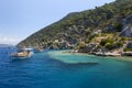 Cruise boats sail past a section of the Sunken City on Kekova Island in Turkey.