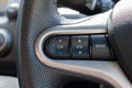 Cruise control buttons on a steering wheel. Royalty Free Stock Photo