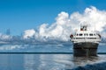 Cruiser, Cruise Liner on River Amazon with huge white Cumulonimbus Clouds Royalty Free Stock Photo