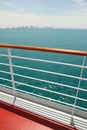 Cruise liner deck with red floor and wooden rail Royalty Free Stock Photo