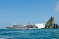 Cruise liner in front of iceberg and ragged rock in Antarctia, Point Wild, Elephant Island