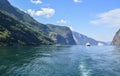 Cruise liner and little tourist boat crossing on one of the most beautiful fjords Sognefjord in Flam Norway Royalty Free Stock Photo
