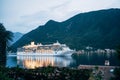 The cruise liner sails at night on the Bay of Kotor in Montenegro, near Perast. Royalty Free Stock Photo