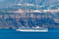 Cruise liner ship vessel in Aegean sea near Santorini island. Oia Fira village Santorini, Greece Royalty Free Stock Photo