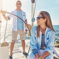 Cruise, ocean and together for holiday on yacht with sun in the summer with the waves. People, boat and vacation on