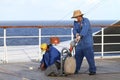 Cruise operators polishing the deck.