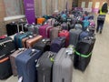 Cruise passengers luggage at a collection point in a cruise terminal.
