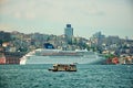 Cruise Ship against small tourist boat in Istanbul Port Royalty Free Stock Photo