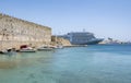 A Cruise Ship is Anchored Not Far from the Medieval Wall of Old Town Rhodes, Greece