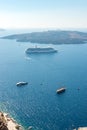 Cruise ship and boats close to the Santorini island.