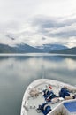 Cruise ship bow heading along fjord Royalty Free Stock Photo