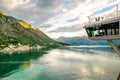 Cruise ship bridge in Montenegro Kotor Bay looking at scenic village with tall mountains during sunrise