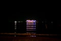Cruise ship with bright lights sailing in the dark in Andaman sea near Phuket, Thailand. Dinner Cruise Ship Royalty Free Stock Photo