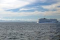 Cruise ship passing in front of Cuba, in the distance, seen across the Caribbean Sea