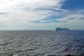 Cruise ship passing in front of Cuba, in the distance, seen across the Caribbean Sea