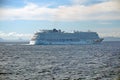 Cruise ship passing in front of Cuba, in the distance, seen across the Caribbean Sea