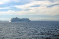 Cruise ship passing in front of Cuba, in the distance, seen across the Caribbean Sea