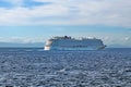 Cruise ship passing in front of Cuba, in the distance, seen across the Caribbean Sea