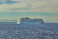 Cruise ship passing in front of Cuba, in the distance, seen across the Caribbean Sea