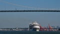 A cruise ship croses under the Lions Gate bridge as it makes its way out of the Port of Vancouver.