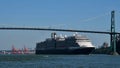 A cruise ship croses under the Lions Gate bridge as it makes its way out of the Port of Vancouver.