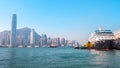 Cruise ship dock embarkment Port Ocean Terminal in Victoria Harbour and Hong Kong Skyline Cityscape at sunrise from Tsim Sha Tsui