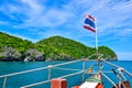 Cruise ship with Thailand national flag heading to Angthong island national marine park near Samui island through a very beautiful Royalty Free Stock Photo