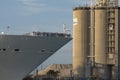 Cruise ship leaving port giving the passengers a view of cement silos. Port Canaveral, Florida. Royalty Free Stock Photo