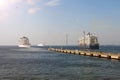 Cruise ship liner goes into horizon the blue sea leaving port. water seascape concept of sea travel Royalty Free Stock Photo