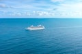 Cruise ship liner sails in the blue sea leaving a plume, seascape. Aerial view The concept of sea travel, cruises Royalty Free Stock Photo