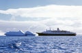 Cruise ship Marco Polo with glaciers and icebergs in Errera Channel at Culverville Island, Antarctica