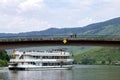 Cruise ship on the Moselle and sightseers on bridge