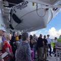 A cruise ship muster drill where all passengers and crew are to report to their assembly station is in case of emergency