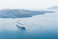 Cruise ship near the sea coast of Santorini island, Greece. Royalty Free Stock Photo