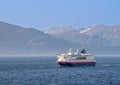 cruise ship Nordlys in Norway with snow capped mountains in background