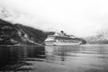 Cruise ship in norwegian fjord. Passenger liner docked in port. Travel destination, tourism. Adventure, discovery Royalty Free Stock Photo