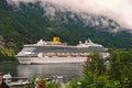 Cruise ship in norwegian fjord. Travel destination, tourism. Adventure, discovery, journey. Passenger liner docked in Royalty Free Stock Photo