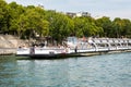 Cruise ship parking at the dock in the Seine river on a sunny day in Paris, France